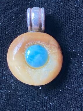 Hand Crafted Fossil Ivory Round Pendant with Larimar Center